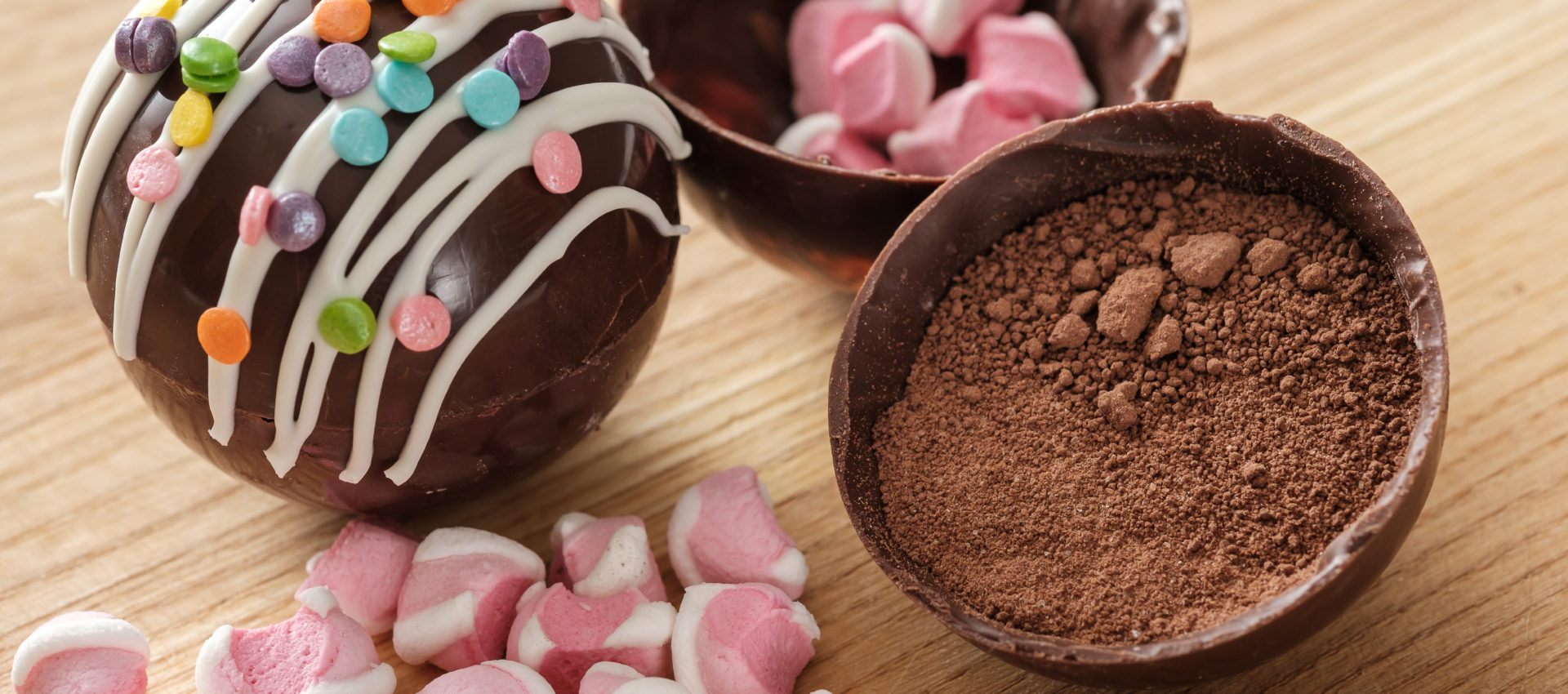 Cocoa bombs are black chocolate shells filled with cocoa powder and marshmallows